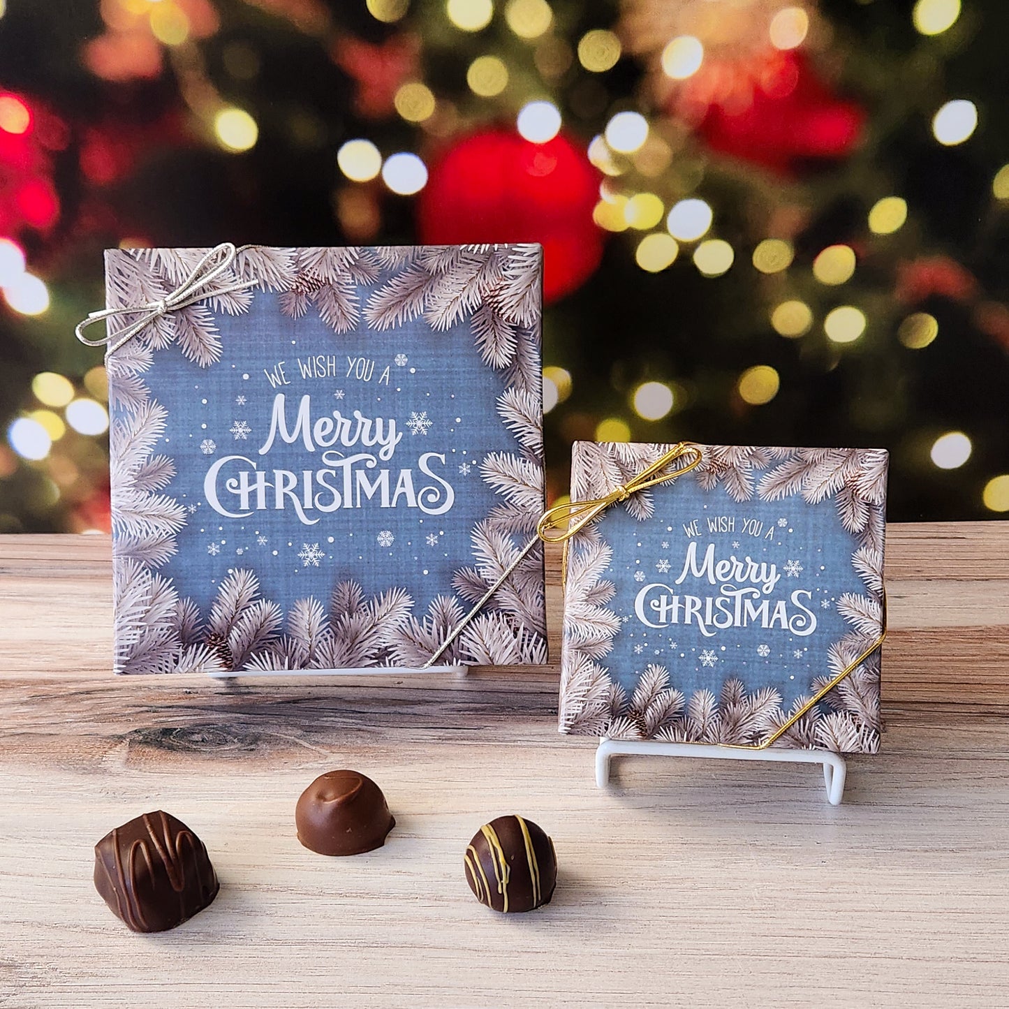 An assortment of our most popular milk and dark chocolate creams, caramels, melt-aways, and truffles all packed inside a box with the saying "We Wish You A Merry Christmas" printed on the cover.