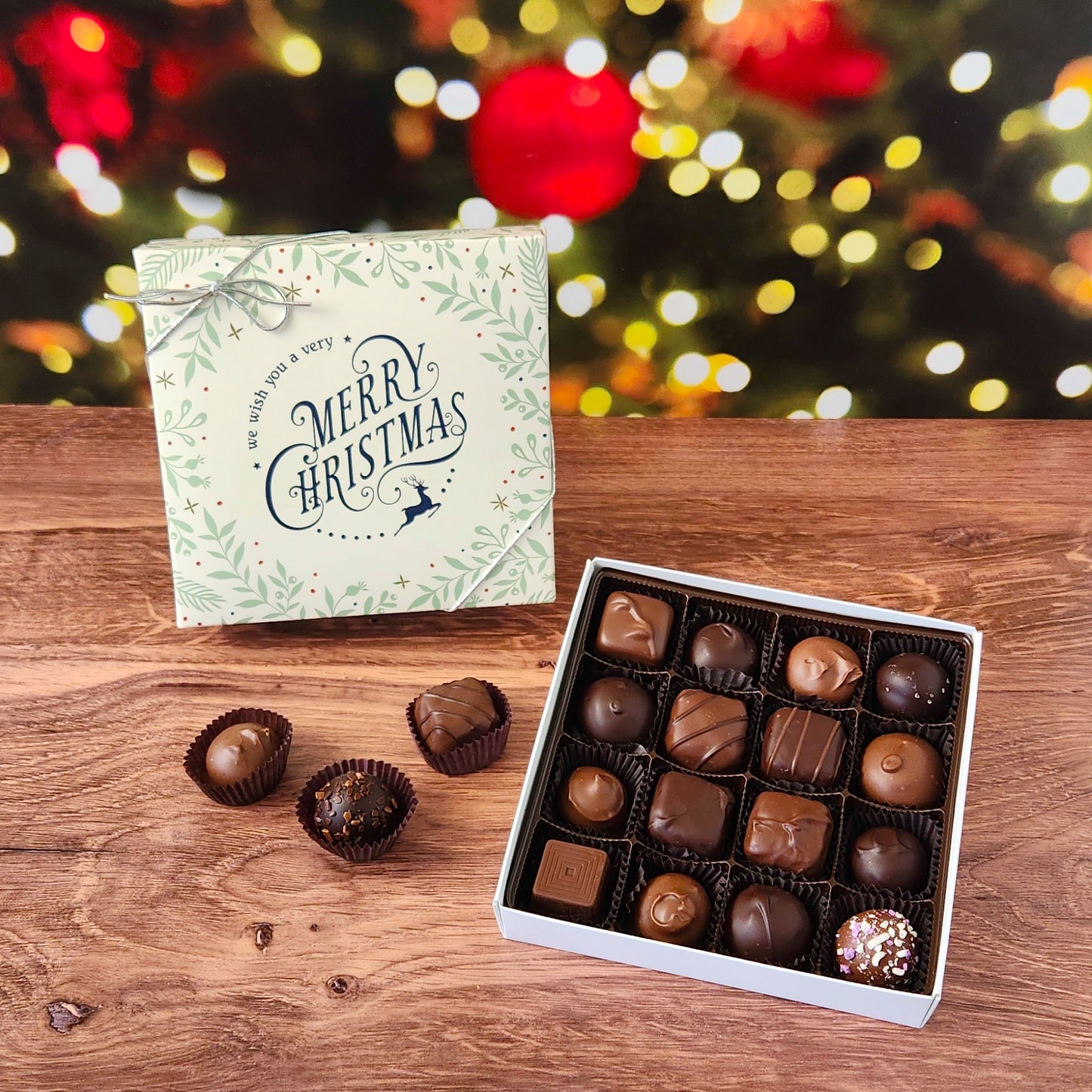 We Wish You a Merry Christmas 16 Piece Chocolate Assortment.  Inside, you'll find a handpicked selection of our most popular milk and dark chocolates. Creamy soft centers, buttery caramels, dreamy melt-aways, and decadent truffles.