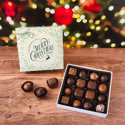 We Wish You a Merry Christmas 16 Piece Chocolate Assortment.  Inside, you'll find a handpicked selection of our most popular milk and dark chocolates. Creamy soft centers, buttery caramels, dreamy melt-aways, and decadent truffles.