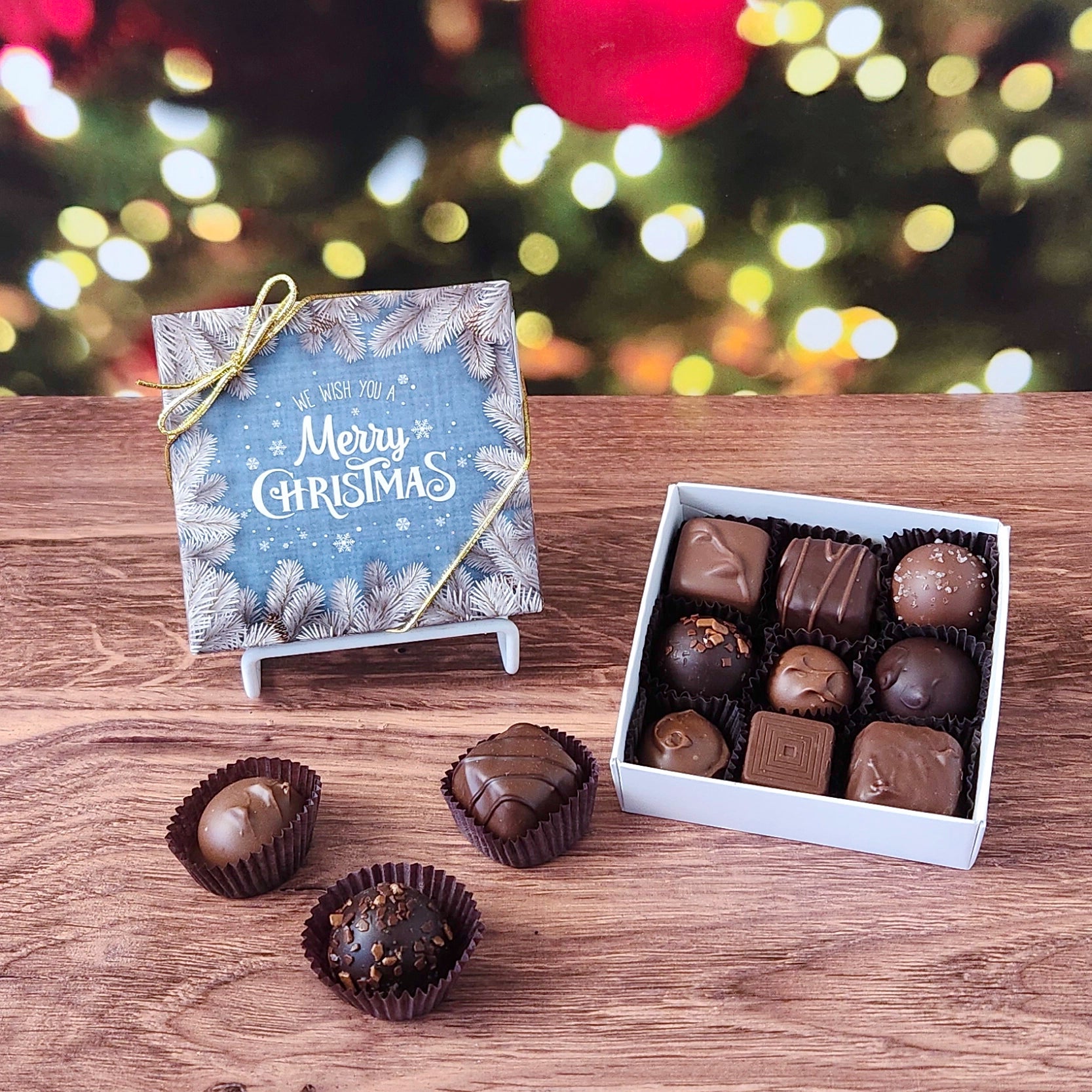 We Wish you A Merry Christmas 9 Piece Chocolate Assortment.  Inside this festive box is a handpicked selection of our most popular milk and dark chocolates.   You’ll discover a variety of gooey caramels, rich truffles, creamy centers, and smooth melt-aways