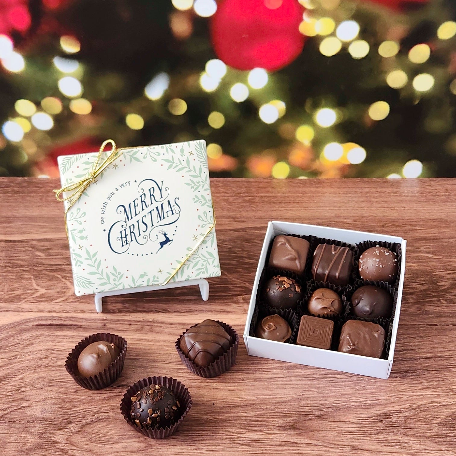 We Wish You a Merry Christmas 9 Piece Chocolate Assortment.  Inside, you'll find a handpicked assortment of our most popular milk and dark chocolates. Think creamy centers, buttery caramels, dreamy melt-aways, and decadent truffles