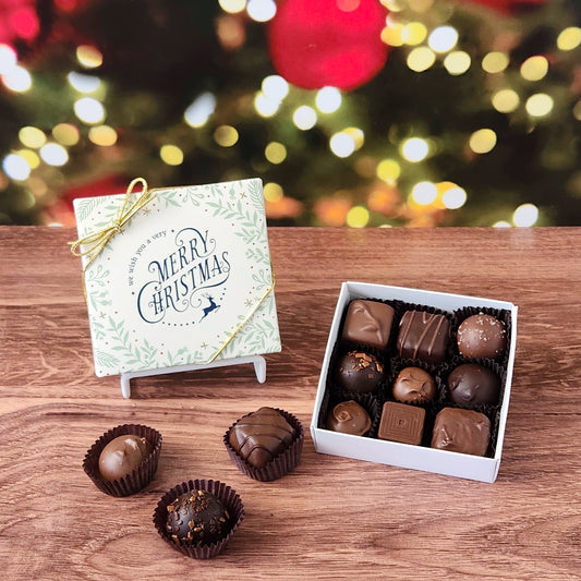 We Wish You a Merry Christmas 9 Piece Chocolate Assortment.  Inside, you'll find a handpicked assortment of our most popular milk and dark chocolates. Think creamy centers, buttery caramels, dreamy melt-aways, and decadent truffles