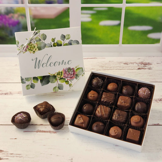16 Piece assortment of milk and dark chocolate creams, caramels, melt‑aways and truffles inside a beautiful welcome box.