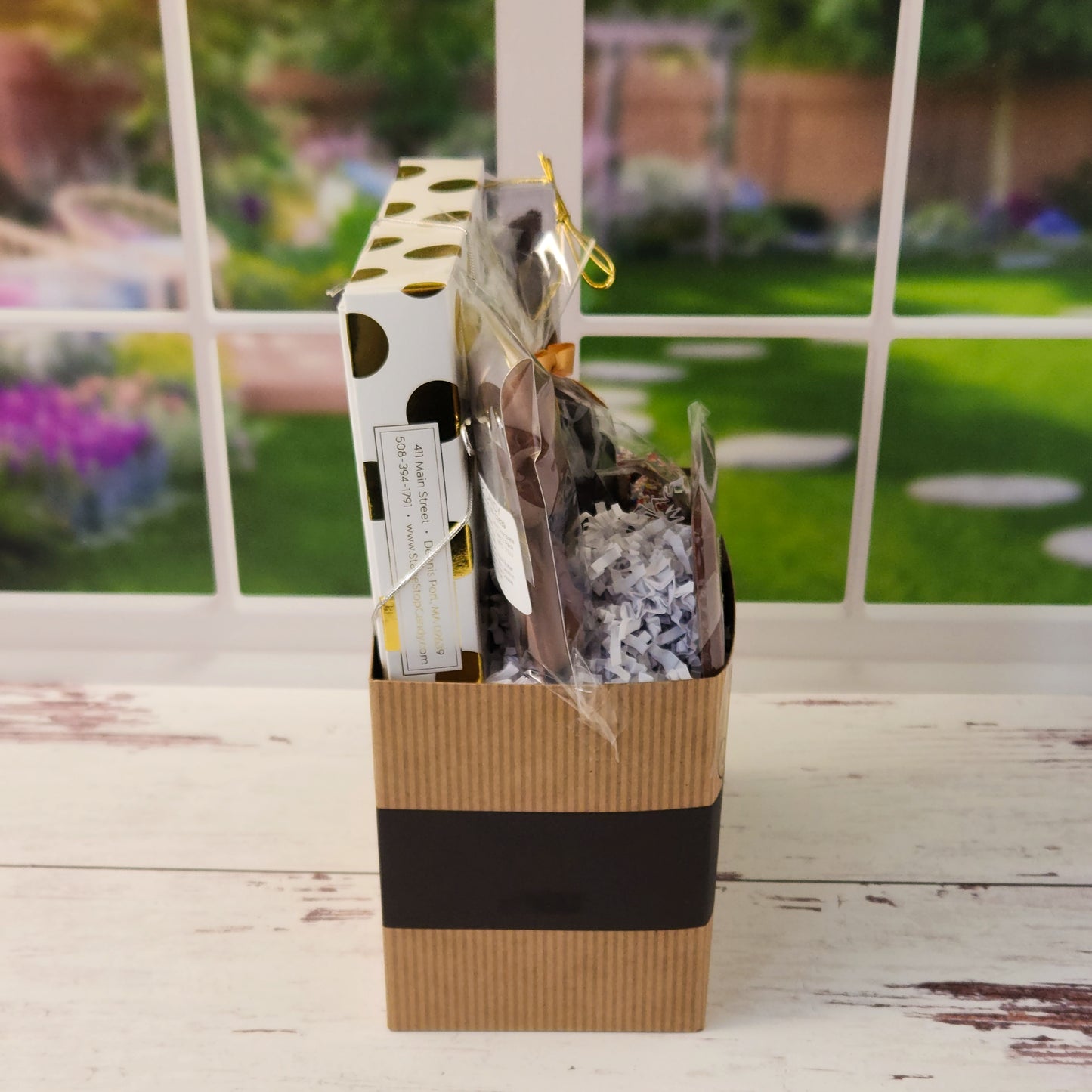 Our Welcome Gift Basket is filled with thoughtful treats  including: 
Milk, Dark & White Chocolate Sea Shells,  Milk Chocolate Nonpareils,  Dark Chocolate Covered Cranberries,  Two Chocolate Covered Oreos, a "Welcome" Milk Chocolate Bar and a 16-Piece Chocolate Assortment – filled with creams, caramels, meltaways, and truffles.  All overwrapped with a bow and ready for gifting.