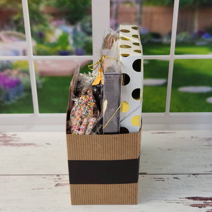 Our Welcome Gift Basket is filled with thoughtful treats  including: 
Milk, Dark & White Chocolate Sea Shells,  Milk Chocolate Nonpareils,  Dark Chocolate Covered Cranberries,  Two Chocolate Covered Oreos, a "Welcome" Milk Chocolate Bar and a 16-Piece Chocolate Assortment – filled with creams, caramels, meltaways, and truffles.  All overwrapped with a bow and ready for gifting.