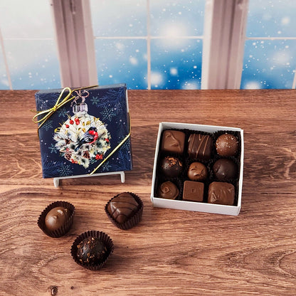 9 Piece Winter Bird Chocolate Assortment.  Inside, you'll find a handpicked assortment of our most popular milk and dark chocolates. Think creamy centers, buttery caramels, dreamy melt-aways, and decadent truffles