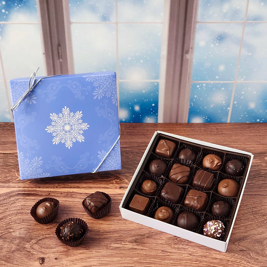 16 Piece  Winter Snowflake Chocolate Assortment.  Inside, you'll find a handpicked selection of our most popular milk and dark chocolates. Creamy soft centers, buttery caramels, dreamy melt-aways, and decadent truffles.