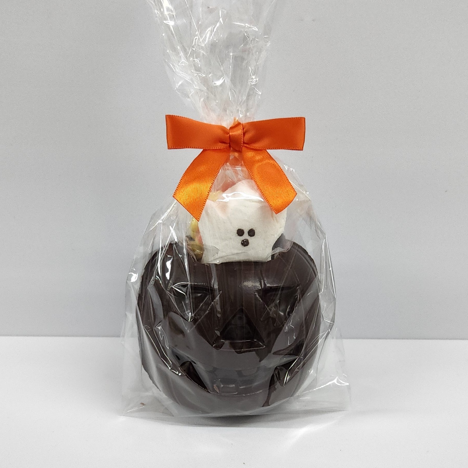 Dark Chocolate 3D Pumpkin with Orange Taffy, Candy Corn and a Ghost Peep inside. 