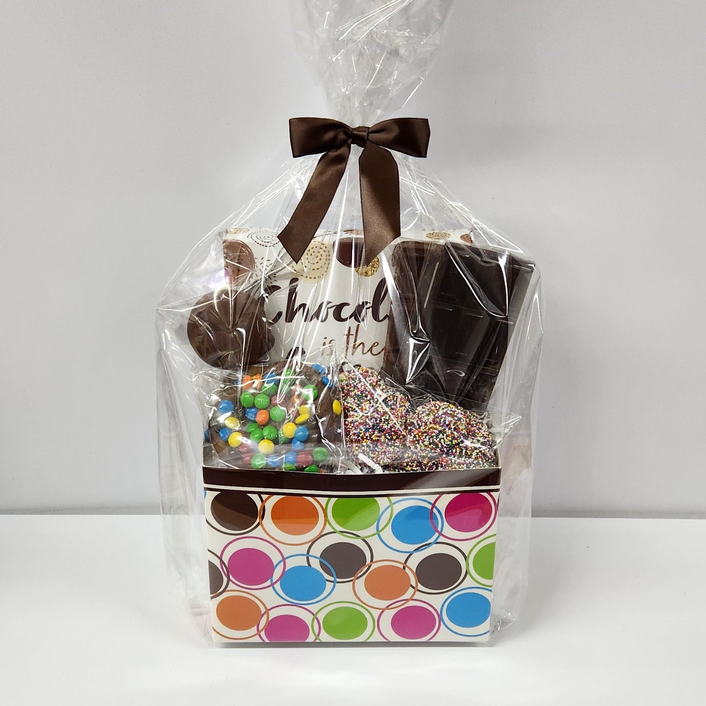 Chocolate Lovers Gift Basket from Stage Stop Candy wrapped in plastic with brown bow