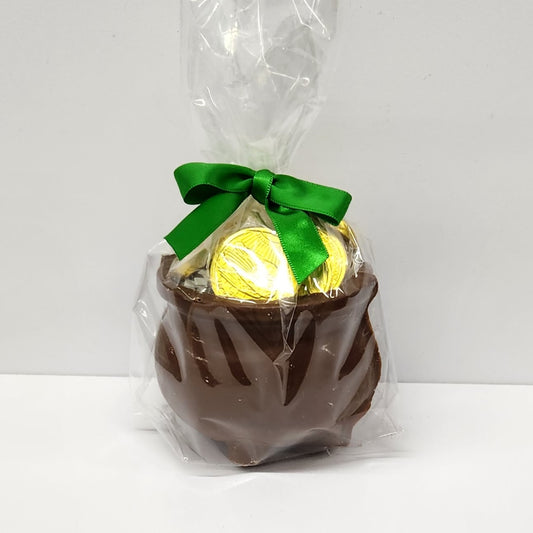 Chocolate pot of gold filled with shiny milk chocolate coins, wrapped in plastic with a green bow