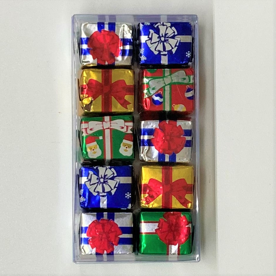 Box of 10 bite sized milk chocolates wrapped in decorative Christmas present foils