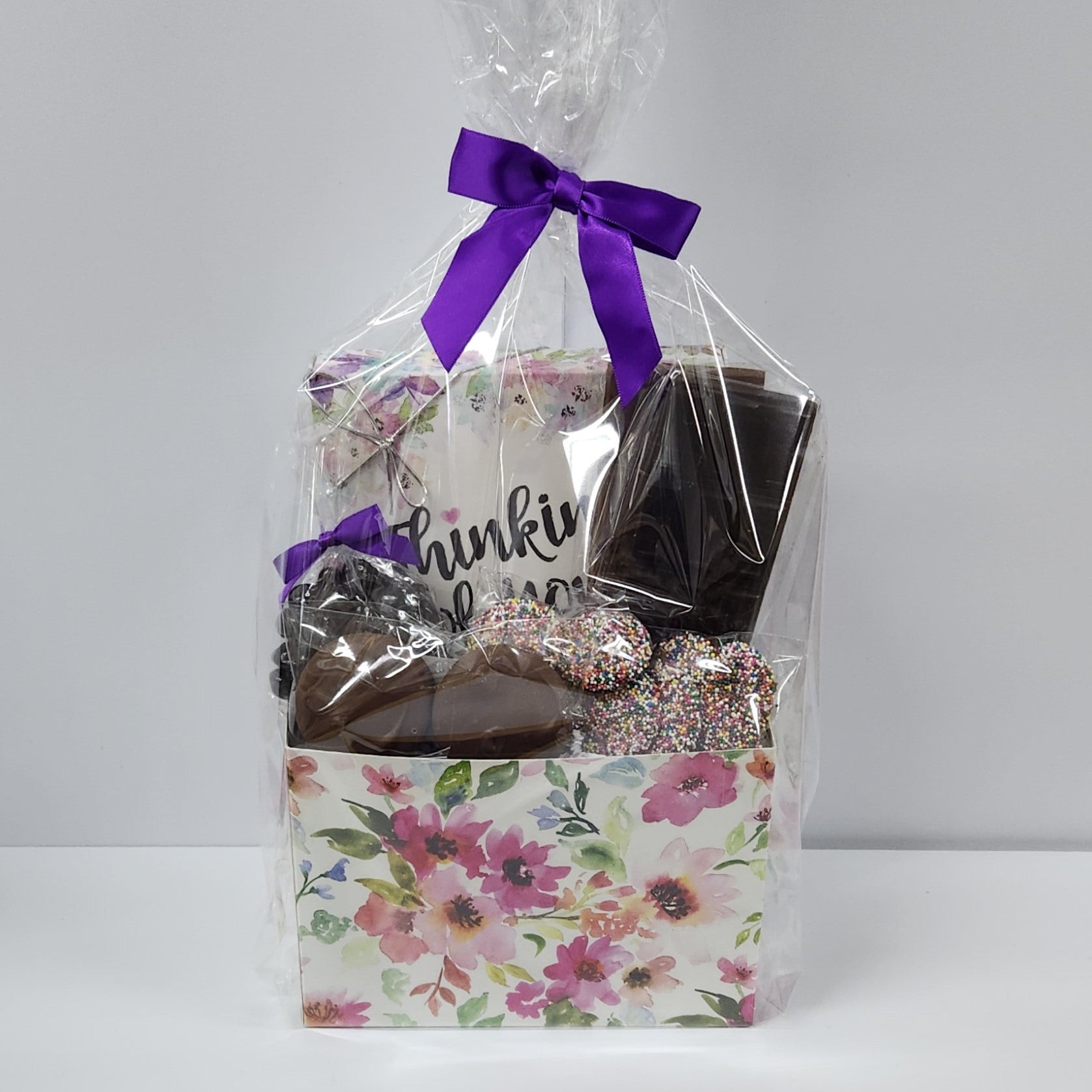 Thinking of You Chocolate Gift Basket from Stage Stop Candy wrapped in plastic with purple bow