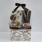 Chocolate Drizzle Patterned Gift Basket from Stage Stop Candy wrapped in plastic with matching chocolate brown bow