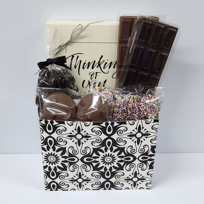 Black Paisley Thinking of You Gift Basket includes milk and dark chocolate candy bars, dark chocolate covered cranberries, milk chocolate covered Oreos and milk chocolate nonpareils. Plus, our 16-piece assortment of creams, caramels, meltaways and truffles