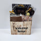 Chocolate Welcome Home Basket includes milk, dark and white chocolate sea shells, crunchy milk chocolate nonpareils, savory dark chocolate covered cranberries, and a 16 piece chocolate assortment filled with creams, caramels, meltaways and truffles.