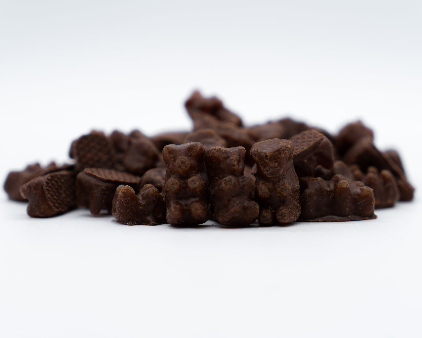 closeup of milk chocolate covered gummy bears