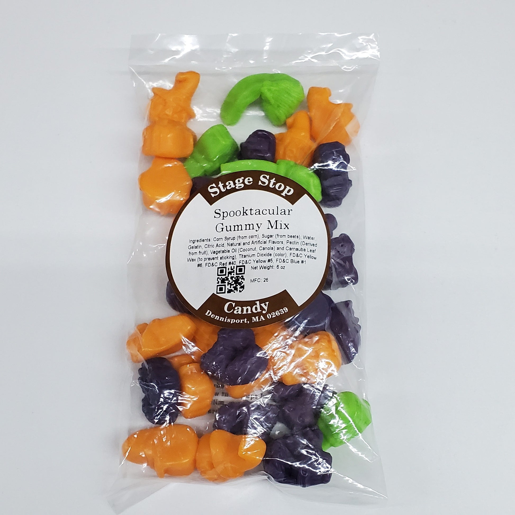 Bag of Halloween Gummy Mix with Orange flavored jack-o'-lanterns, Grape flavored kittens, and Green Apple flavored witches' broomsticks.
