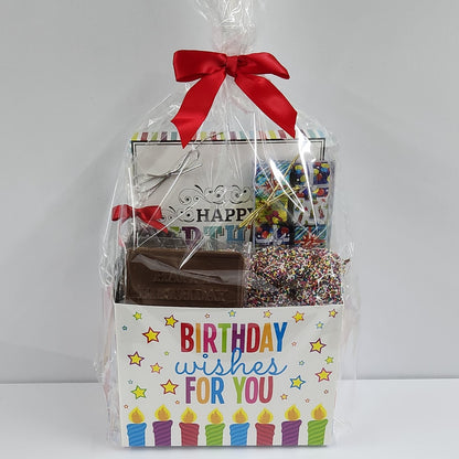 Birthday Wishes Candy Gift Basket from Stage Stop Candy wrapped in plastic with a red bow