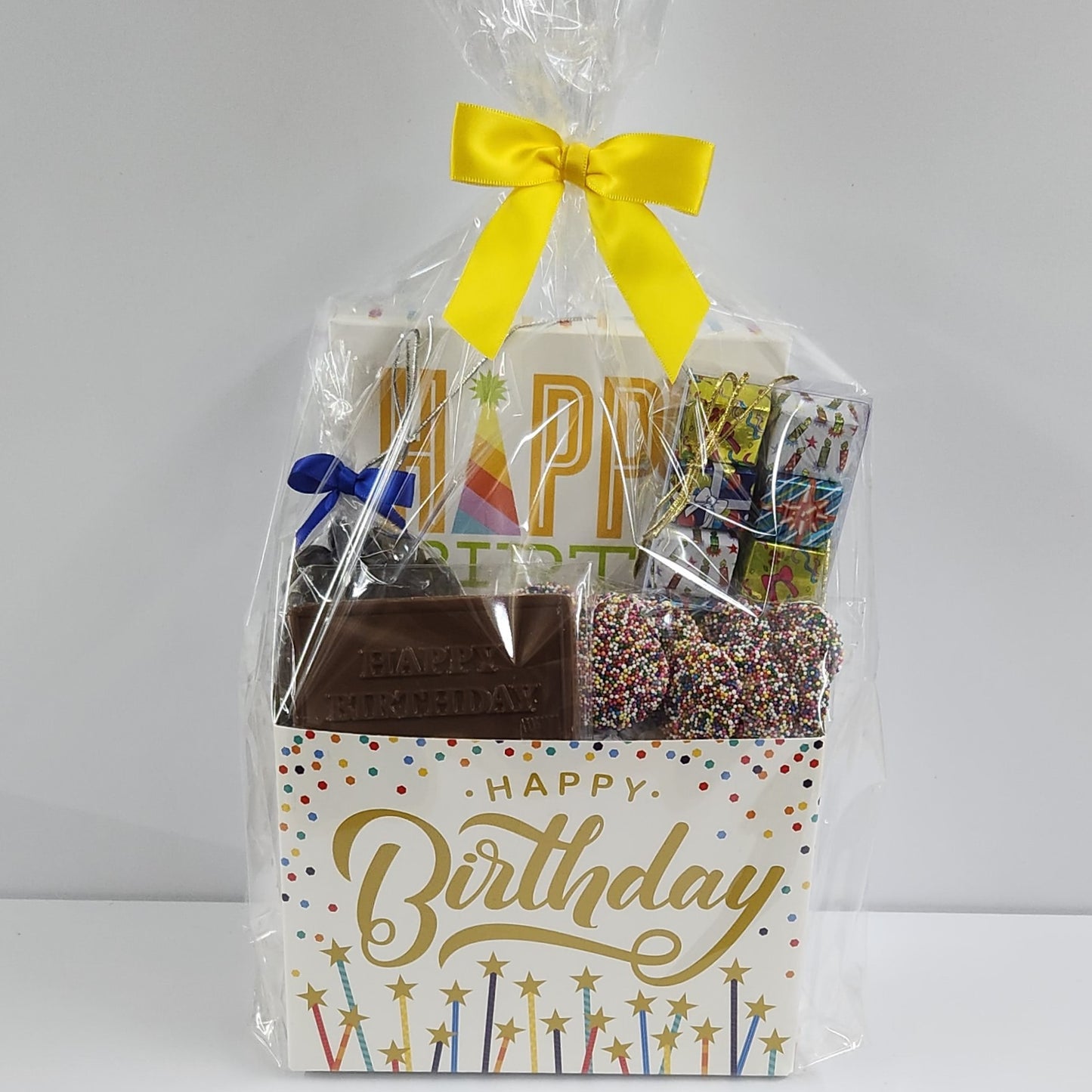 Happy Birthday Candy Gift Basket from Stage Stop Candy wrapped in plastic with a yellow bow