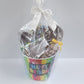 Stage Stop Candy Happy Birthday Chocolate Gift Basket wrapped in plastic with a white bow