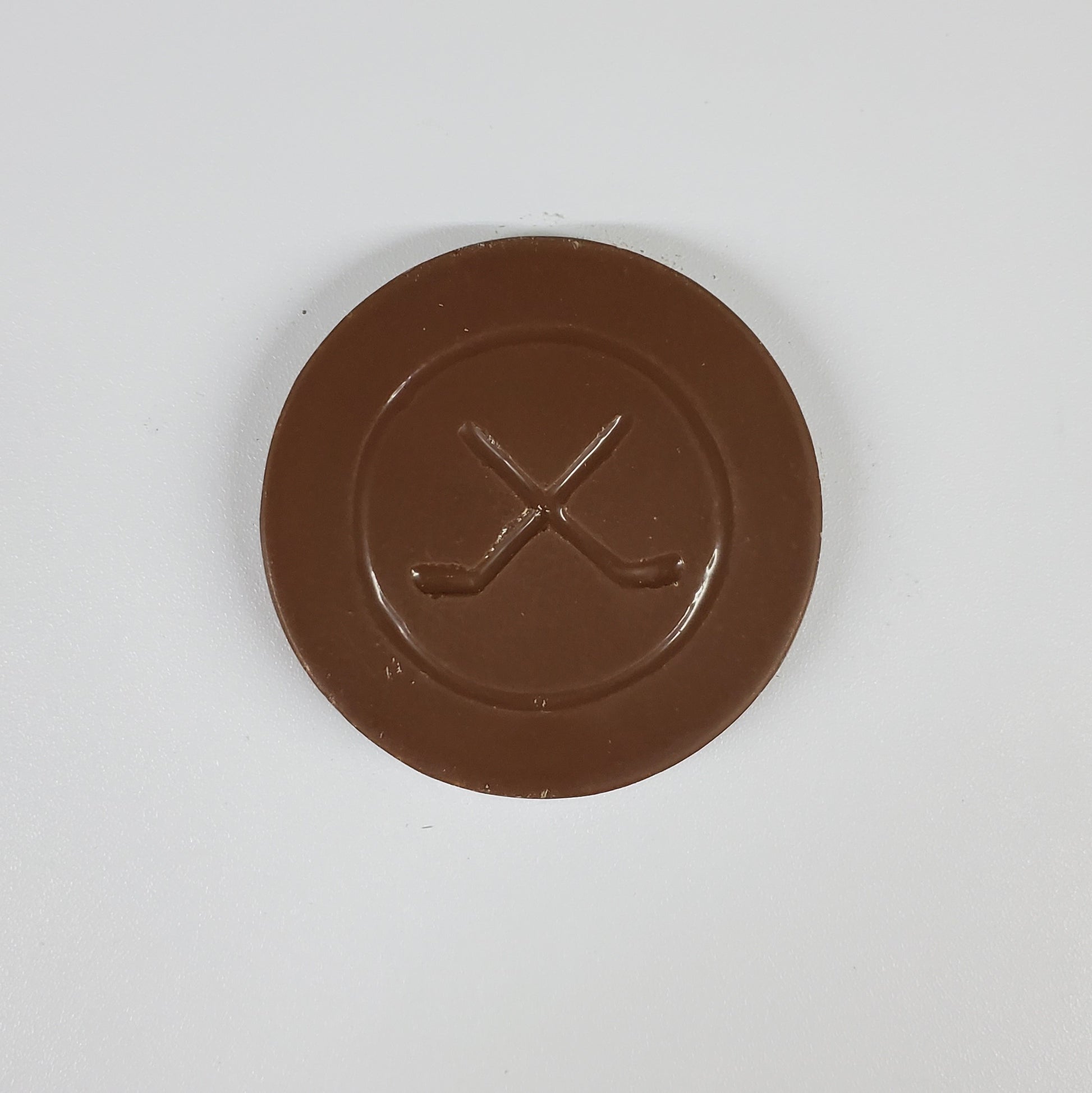 Milk Chocolate in the shape of a hockey puck