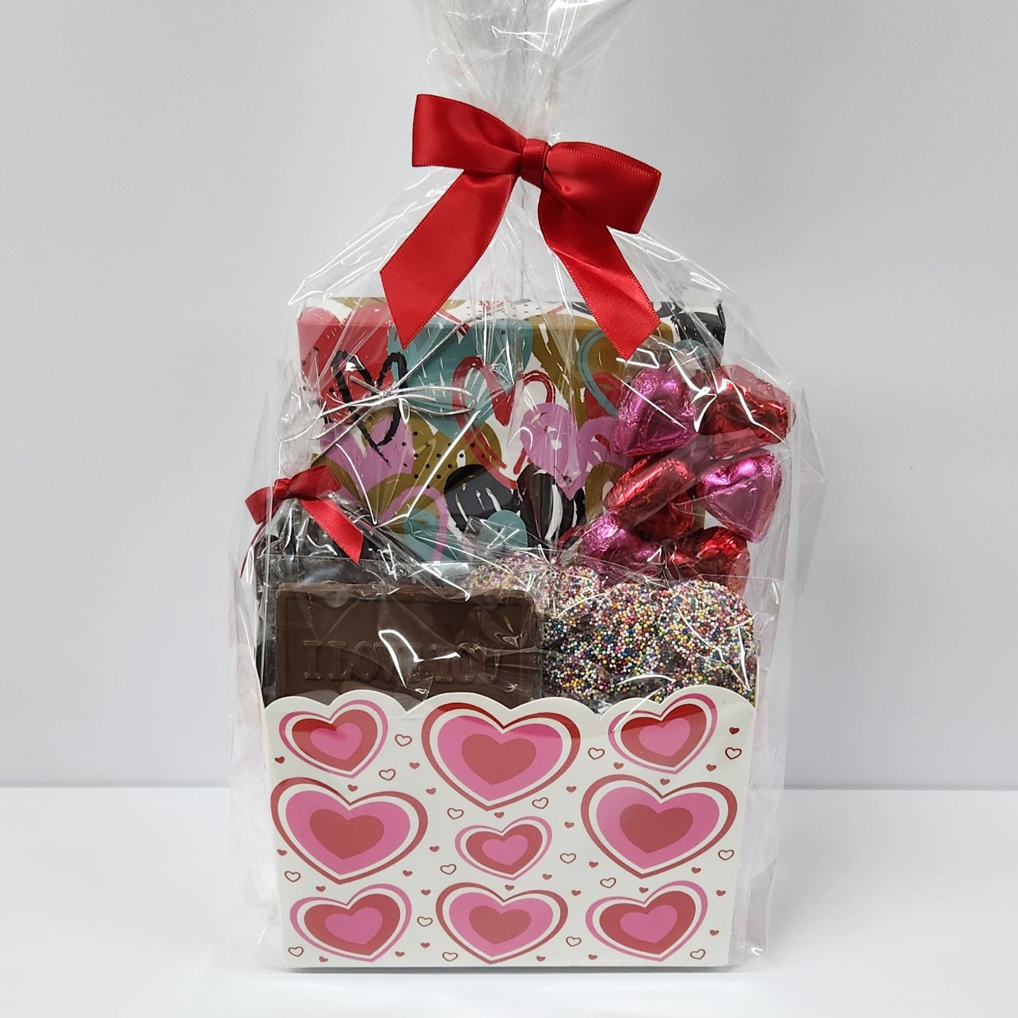 I Love You Gift Basket from Stage Stop Candy wrapped in plastic and tied with a red bow