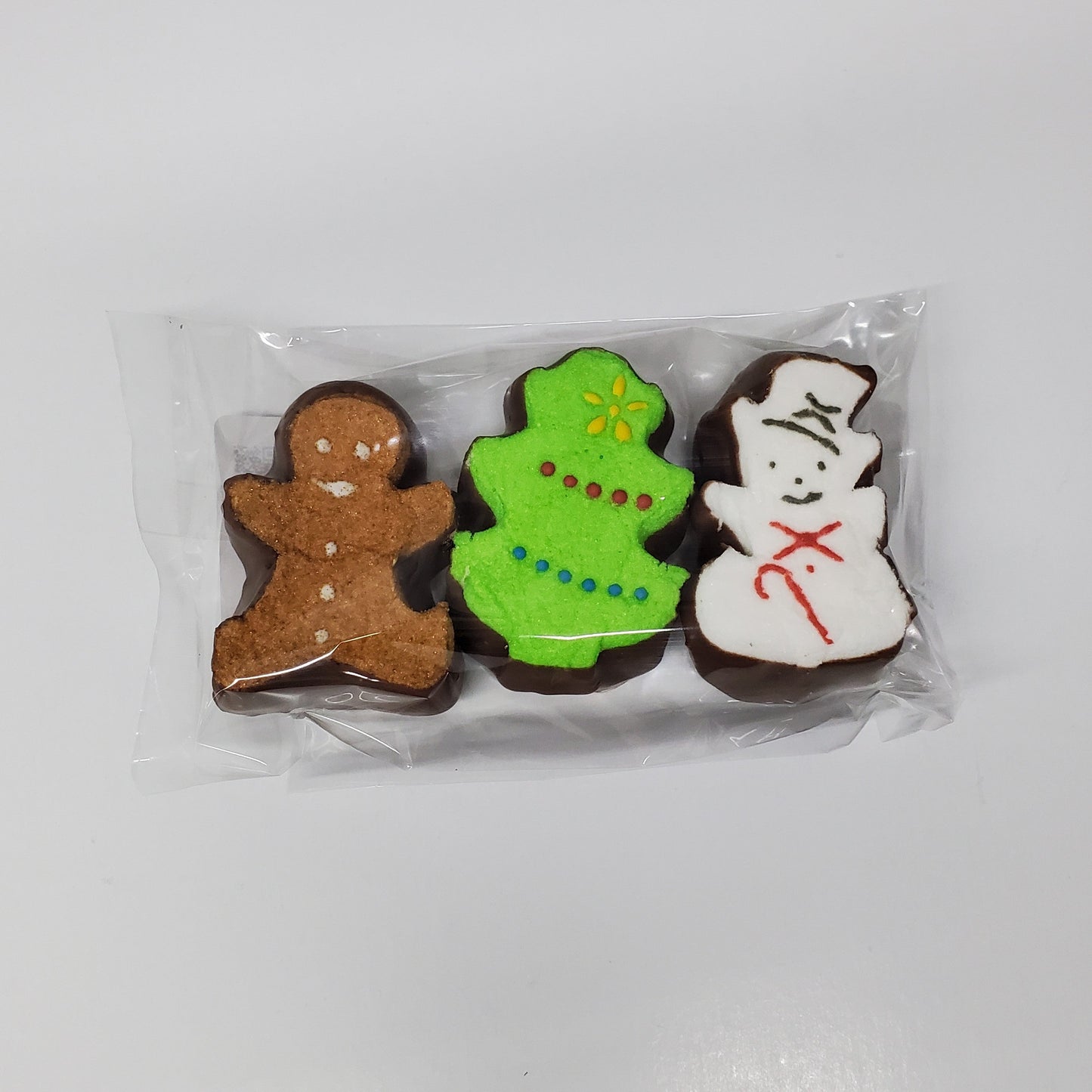 Gingerbread man, Christmas Tree, Snowman shaped Peeps dipped in milk chocolate