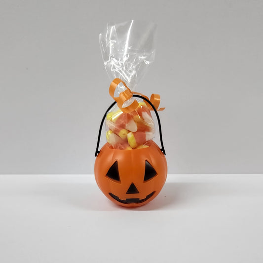Mini plastic pumpkin filled with candy corn