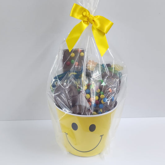 Smile Gift Basket from Stage Stop Candy wrapped in plastic with matching yellow bow