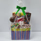 Super Gift Basket from Stage Stop Candy wrapped in plastic with a green bow
